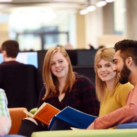 Students sitting in Teesside University Library