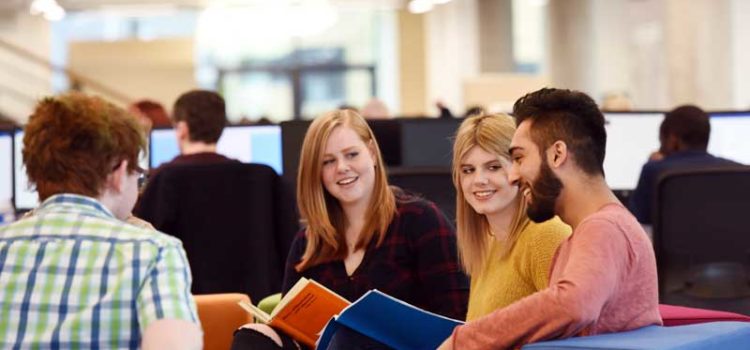 Students sitting in Teesside University Library