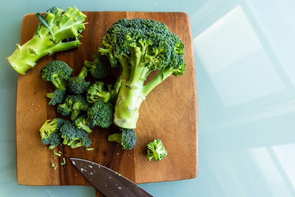 Broccoli on a chopping board.