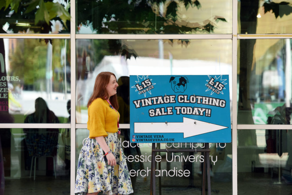 Person standing outside the Students' Union shop