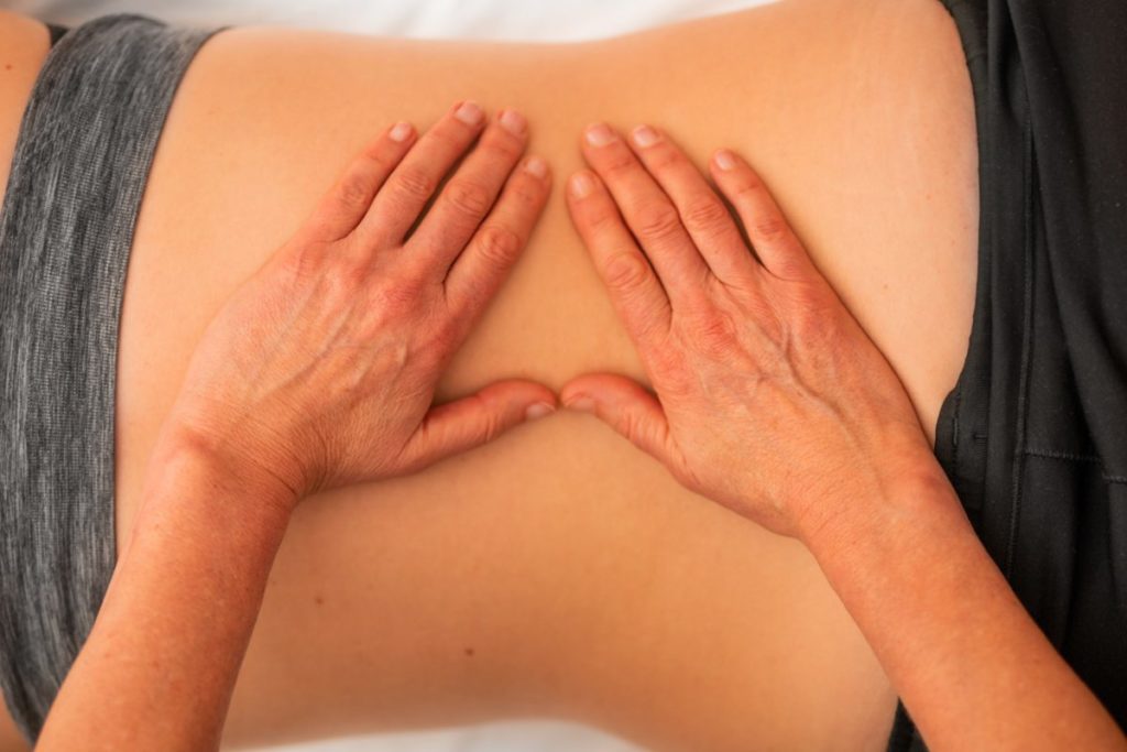 Person receiving physiotherapy massage.