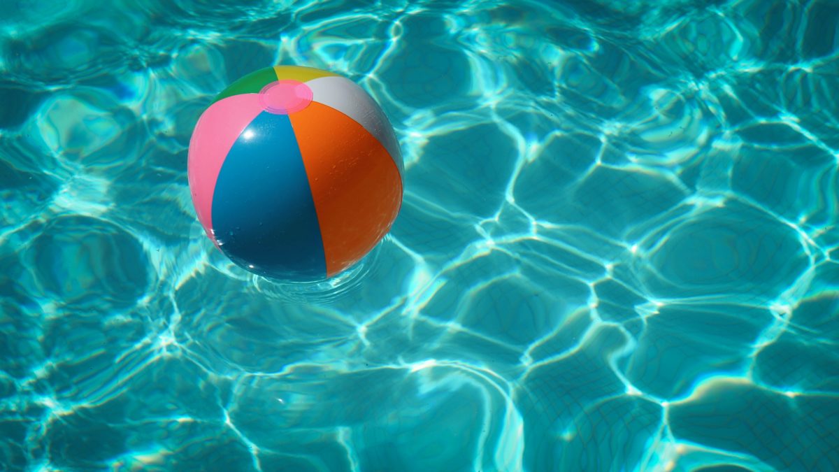 Swimming pool with beach ball floating in it