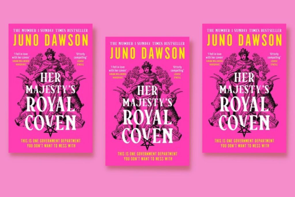 Copies of Juno Dawson's 'Her Majesty's Royal Coven' in a flatlay