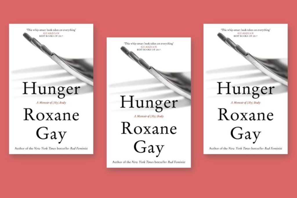 Copies of Roxane Gay's 'Hunger' in a flatlay