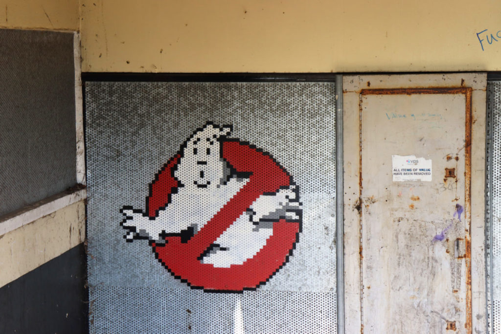 A pixelated Ghostbusters logo