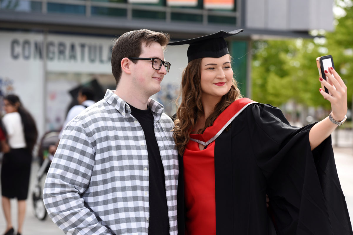 A graduate getting a selfie