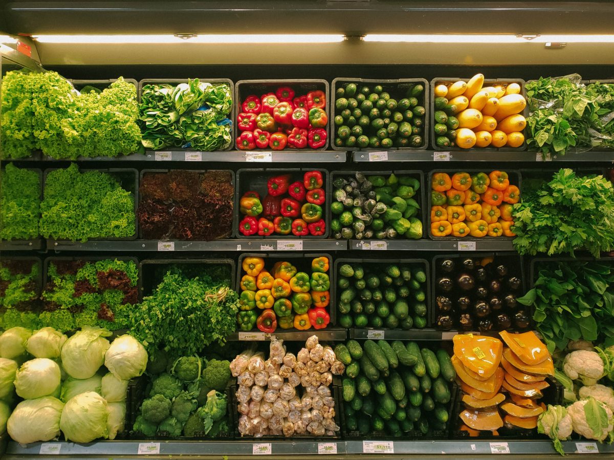 A selection of fruits and vegetables at a supermarket