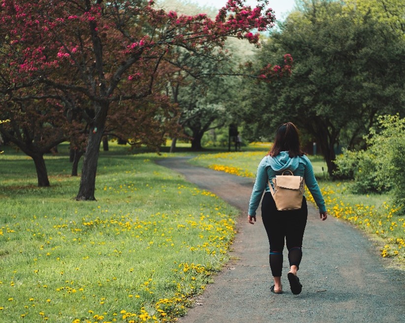 A woman walking alone in the park
