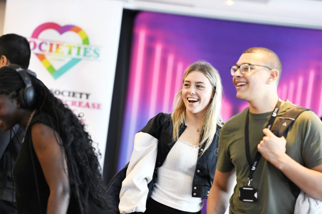 Two students exploring the societies fair