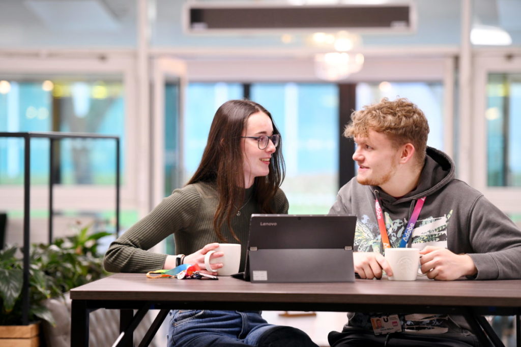 Students in conversation in the Library